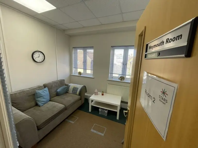 Comfortable room with settee, cushions and table